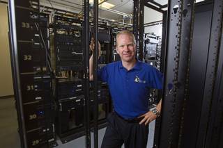 Nathan Whittacre, president of Stimulus Technologies, poses in the company's server room in Henderson Monday, July 8, 2013. Whittacre and his brother started the business in a garage in 1995, he said.