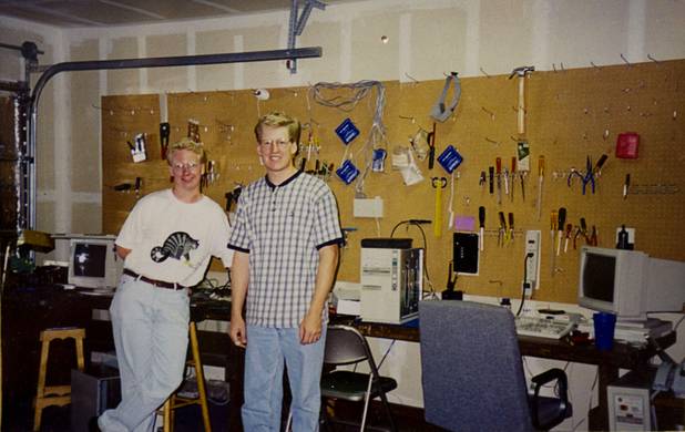 Nathan Whittacre, left, president of Stimulus Technologies, poses with his older brother Brett in a 1995 photo. The brothers started Stimulus Technologies in Brett's garage. COURTESY PHOTO