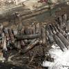 The remains of tanker cars lie burnt out in the downtown core Sunday, July 7, 2013, in Lac Megantic, Quebec.   A runaway train derailed  Saturday igniting tanker cars carrying crude oil and devastated the town. 