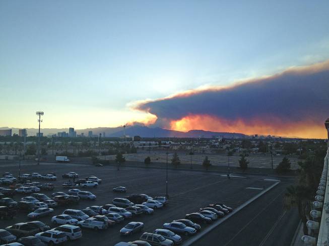A view from Boulder Station of the sunset and smoke from the Mount Charleston wildfire, Monday, July 8, 2013. 