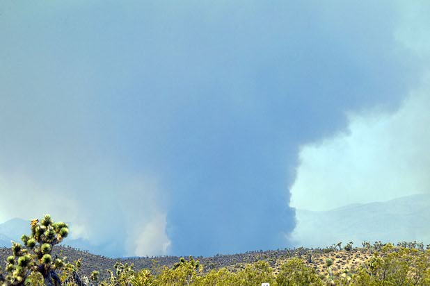 Smoke from the Carpenter 1 wildfire is shown from Kyle Canyon Road on the way up to Mount Charleston Tuesday, July 9, 2013.