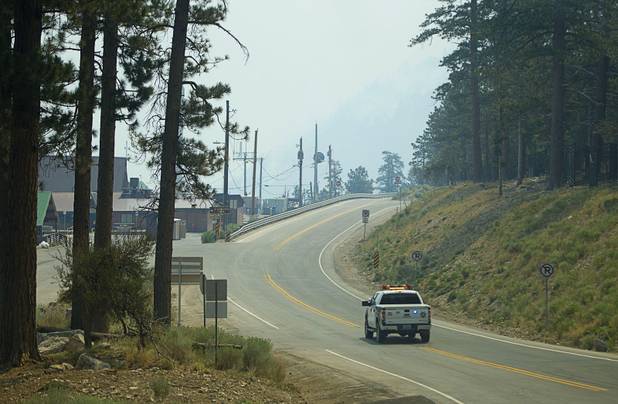 A Metro Police pickup drives by the Mount Charleston Lodge Tuesday, July 9, 2013.