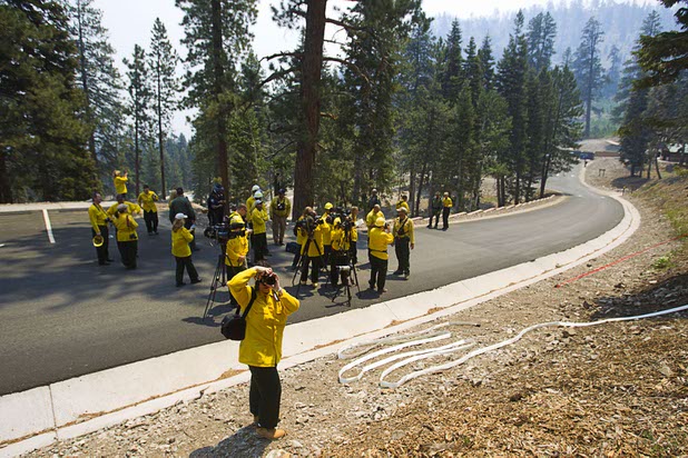 Media are briefed on the Carpenter 1 wildfire during a tour at the Cathedral Rock picnic area on Mount Charleston Tuesday, July 9, 2013.
