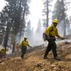A fire crew heads out after a burnout in the Rainbow subdivision on Mount Charleston Tuesday, July 9, 2013.