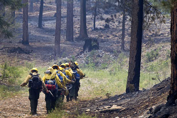 A fire crew heads out from the Rainbow subdivision on Mount Charleston Tuesday, July 9, 2013.