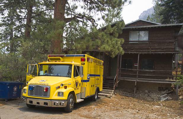 A Clark County Fire Department rescue unit is shown in front of a house in the Rainbow subdivision on Mount Charleston Tuesday, July 9, 2013.