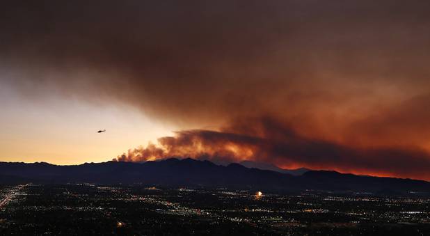 Smoke from the Mount Charleston fire is seen during sunset in Las Vegas on Tuesday, July 9, 2013.