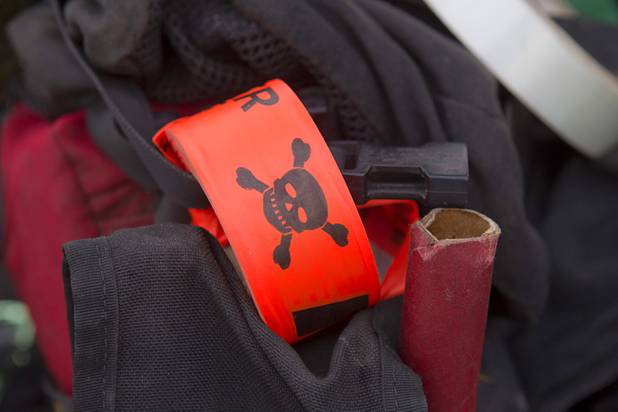 Tape used to mark hazardous trees is shown on a firefighter's bag at Centennial High School Thursday, July 11, 2013.