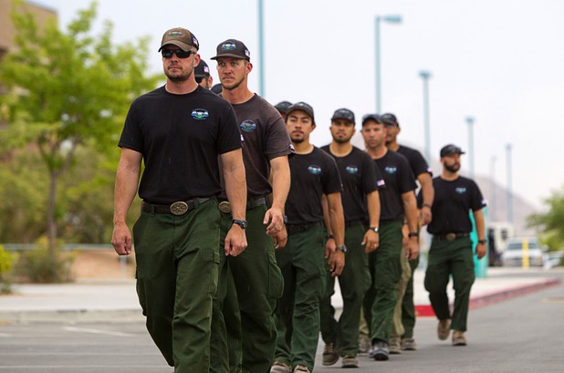 Firefighters from the Stanislaus National Forest prepare to leave Centennial High School and fight the Mount Charleston wildfire Thursday, July 11, 2013.