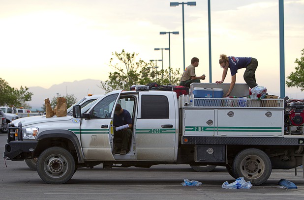 Firefighters prepare to leave Centennial High School and fight the Mount Charleston wildfire Thursday, July 11, 2013.