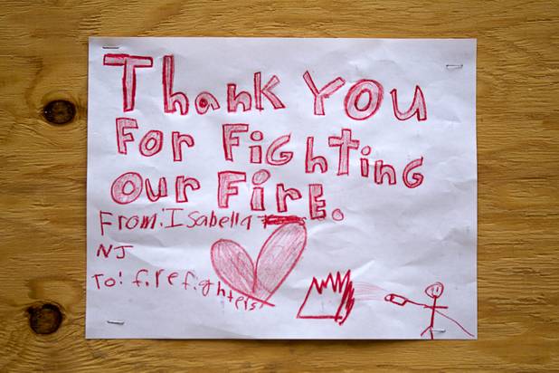 A sign thanks firefighters at Centennial High School and fight the Mount Charleston wildfire Thursday, July 11, 2013.