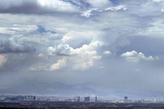 Storm clouds hang over Las Vegas on Friday, July 12, 2013. The National Weather Service has issued a flash flood warning that includes Southern Nevada and is in effect until 11 p.m.