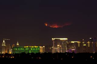 A wildfire glows on Mount Charleston above Las Vegas, Wednesday, July 10, 2013.