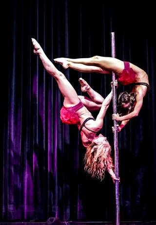 Duo pole act Sarafein and Charisma during the Sapphire Comedy Hour at Sapphire Gentlemen's Club, Friday, July 12, 2013.