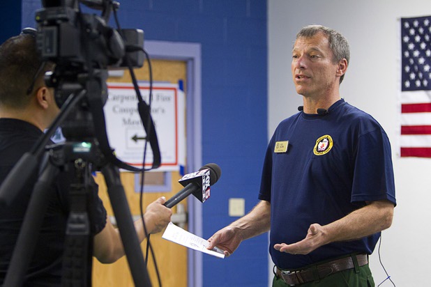Safety Officer Rod Bloms talks about safety conditions on the Mount Charleston wildfire during a briefing at Centennial High School Sunday, July 14, 2013.