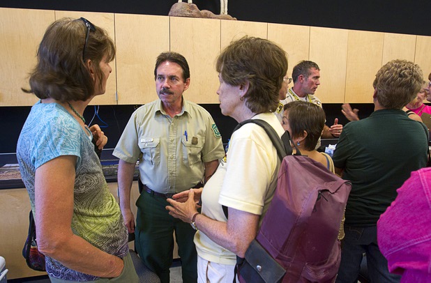 Bill Dunkelberger, left, Humboldt-Toiyabe National Forest Supervisor, left, and Metro Police Captain Patrick Neville answer question from Mount Charleston residents during a public meeting at the Red Rock Canyon Visitor Center Sunday, July 14, 2013.