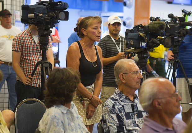 Roberta Boyd, center, encourages support for Mount Charleston businesses during a public meeting at the Red Rock Canyon Visitor Center Sunday, July 14, 2013. Boyd, a Las Vegas resident, was camping in a motorhome with her husband when they were evacuated from Lee Canyon, she said.