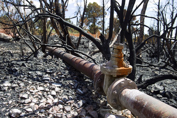 The Trout Canyon water pipeline is shown in Trout Canyon Monday, July 15, 2013. Residents were allowed to return to their homes Sunday but they have no water due to breaks in the pipeline.