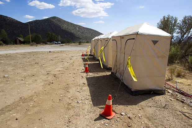 Portable showers are shown in Trout Canyon Monday, July 15, 2013. Residents were allowed to return to their homes Sunday but they have no running water.