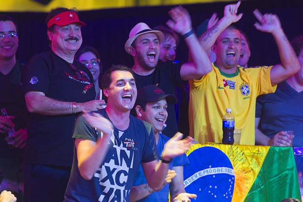 Friends cheer for Bruno Kawauti of Brazil during the seventh day of the World Series of Poker $10,000 buy-in no-limit Texas Hold 'Em at the Rio Monday, July 15, 2013.