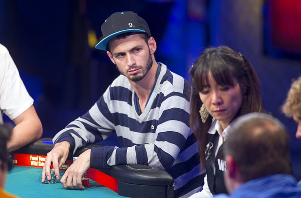 Canadian Alex Livingston competes during the seventh day of the World Series of Poker $10,000 buy-in no-limit Texas Hold 'Em at the Rio Monday, July 15, 2013.