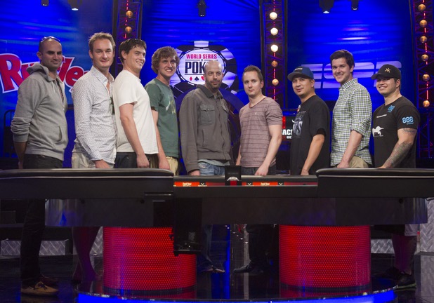 The November Nine pose after making it to the final table in the World Series of Poker $10,000 buy-in no-limit Texas Hold 'Em at the Rio Tuesday morning, July 16, 2013. Players from left are: Sylvain Loosli, Michiel Brummelhuis, Mark Newhouse, Ryan Riess, Amir Lehavot, Marc McLaughlin, JC Tran, David Benefield and Jay Farber. 
