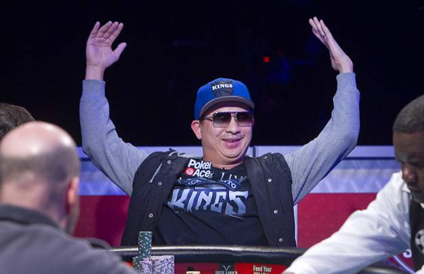 J.C. Tran of Sacramento reacts after losing a hand during the seventh day of the World Series of Poker $10,000 buy-in no-limit Texas Hold 'Em event at the Rio on Monday, July 15, 2013.