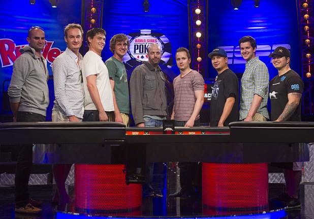 The November Nine pose during the World Series of Poker $10,000 buy-in no-limit Texas Hold 'Em at the Rio Tuesday morning, July 16, 2013. Players from left are: Sylvain Loosli, Michiel Brummelhuis, Mark Newhouse, Ryan Riess, Amir Lehavot, Marc McLaughlin, JC Tran, David Benefield and Jay Farber.
