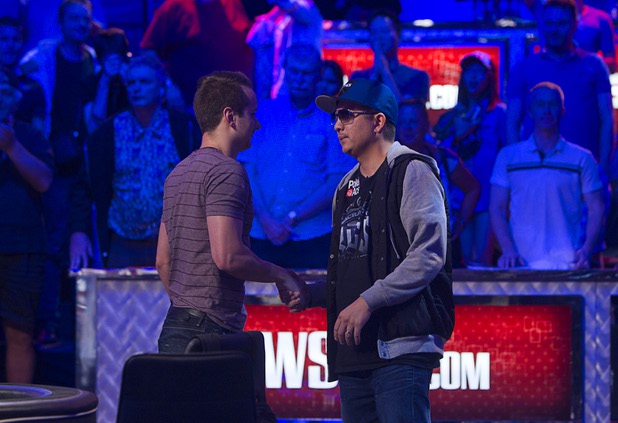 Canadian Marc McLaughlin, left, congratulates JC Tran of Sacramento, Calif. after Tran knocked out Carlos Mortensen of Spain during the World Series of Poker $10,000 buy-in no-limit Texas Hold 'Em at the Rio Tuesday morning, July 16, 2013.