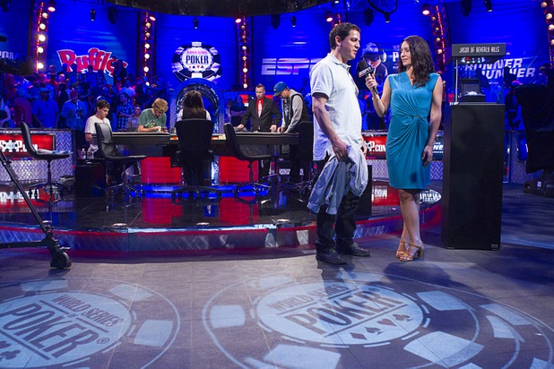 Carlos Mortensen of Spain is interviewed after finishing in 10th place during the World Series of Poker $10,000 buy-in no-limit Texas Hold 'Em at the Rio Tuesday morning, July 16, 2013. From left are: