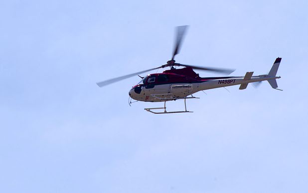 A fire helicopter surveys the Mount Charleston area Thursday, July 18, 2013. The mountain is expected to reopen to the public on Friday.