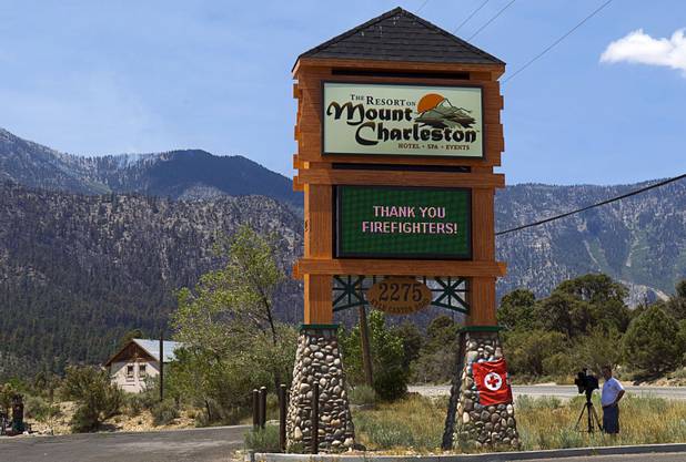A Resort at Mount Charleston sign board sends a message to firefighters Thursday, July 18, 2013. The mountain is expected to reopen to the public on Friday.