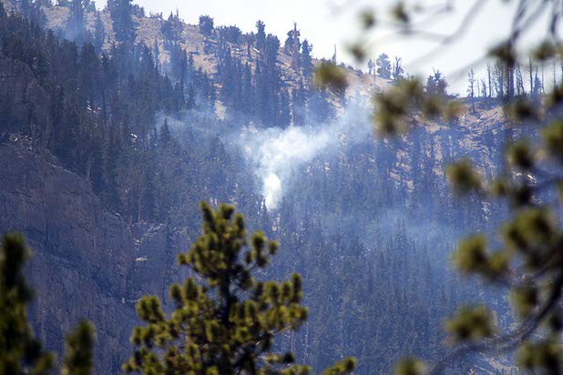 Hot spots continue to smolder on Mount Charleston Thursday, July 18, 2013. The areas is too steep for firefighters and too high in altitude for firefighting helicopters. The mountain is expected to reopen to the public on Friday.