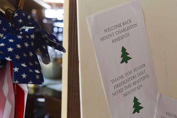 A flyer posted in the Mount Charleston Lodge thanks firefighters Thursday, July 18, 2013. The mountain is expected to reopen to the public on Friday.