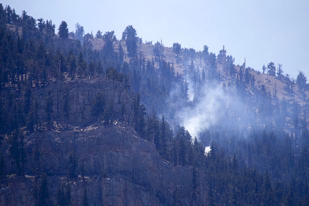 Hot spots continue to smolder on Mount Charleston Thursday, July 18, 2013. The areas is too steep for firefighters and too high in altitude for firefighting helicopters. The mountain is expected to reopen to the public on Friday.