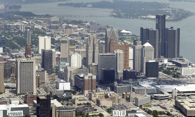 In this July 17, 2013, aerial photo is the city of Detroit. On Thursday, July 18, 2013, Detroit became the largest city in U.S. history to file for bankruptcy when State-appointed emergency manager Kevyn Orr asked a federal judge for municipal bankruptcy protection.