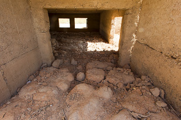 Dried mud is shown under the remains of a structure at the town of St. Thomas in the Lake Mead National Recreation Area Monday, July 22, 2013. The town started as a farming settlement in 1865 but was covered by the rising waters of Lake Mead in the 1930's after the construction of Hoover Dam.