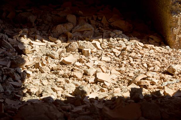 Dried mud is shown under the remains of a structure at the town of St. Thomas in the Lake Mead National Recreation Area Monday, July 22, 2013. The town started as a farming settlement in 1865 but was covered by the rising waters of Lake Mead in the 1930's after the construction of Hoover Dam.