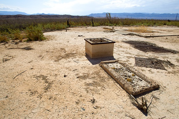 A water cistern with sand filtering trough is shown by the remains of an auto garage at the town of St. Thomas in the Lake Mead National Recreation Area Monday, July 22, 2013. The town started as a farming settlement in 1865 but was covered by the rising waters of Lake Mead in the 1930's after the construction of Hoover Dam.