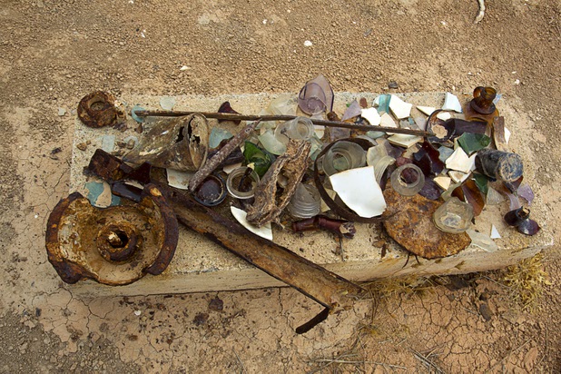 Broken glass and rusted pieces of metal are shown at the town of St. Thomas in the Lake Mead National Recreation Area Monday, July 22, 2013. The town started as a farming settlement in 1865 but was covered by the rising waters of Lake Mead in the 1930's after the construction of Hoover Dam.