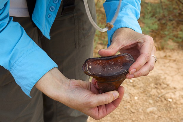 Glendee Ane Osbourne, an archeologist with Lake Mead National Recreation Area, looks over a broken bottle at the town of St. Thomas in the Lake Mead National Recreation Area Monday, July 22, 2013. The town started as a farming settlement in 1865 but was covered by the rising waters of Lake Mead in the 1930's after the construction of Hoover Dam.