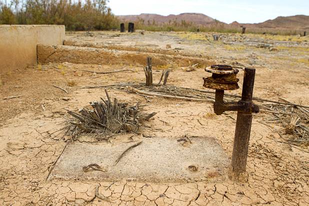 Equipment is shown by a water cistern at the town of St. Thomas in the Lake Mead National Recreation Area Monday, July 22, 2013. The town started as a farming settlement in 1865 but was covered by the rising waters of Lake Mead in the 1930's after the construction of Hoover Dam.