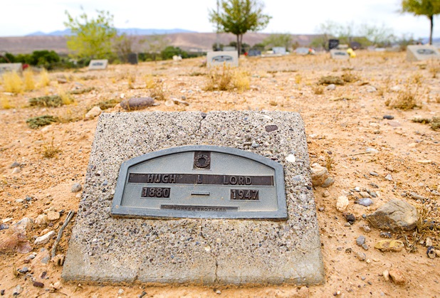 A marker shows the resting place of Hugh Lord, reported to be the last resident to leave St. Thomas, in the St. Thomas Memorial Cemetery in Overton Monday, July 22, 2013. The cemetery was moved from St. Thomas in 1935. The town started as a farming settlement in 1865 but was covered by the rising waters of Lake Mead in the 1930's after the construction of Hoover Dam.