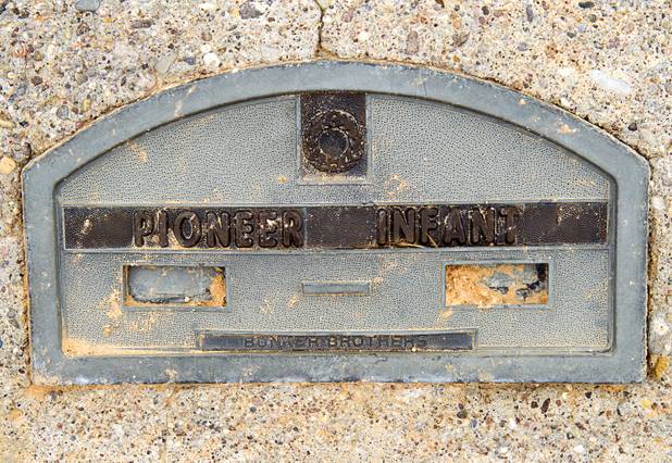 A plaque marks the remains of an unidentified infant in the St. Thomas Memorial Cemetery in Overton Monday, July 22, 2013. The cemetery was moved from St. Thomas in 1935. The town started as a farming settlement in 1865 but was covered by the rising waters of Lake Mead in the 1930's after the construction of Hoover Dam.