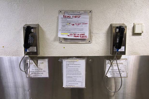 Phones are shown in a booking area during a tour of the Clark County Detention Center Tuesday, July 23, 2013.