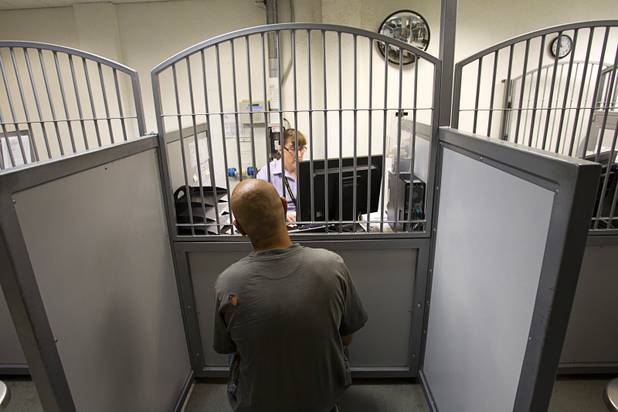 An inmate sits in a pretrial services station during a tour of the Clark County Detention Center Tuesday, July 23, 2013.