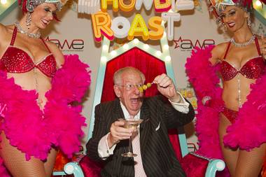 Former Las Vegas Oscar Goodman removes olives from his martini after arriving for “The Showbiz Roast” at the Stratosphere Theater Tuesday, July 23, 2013.