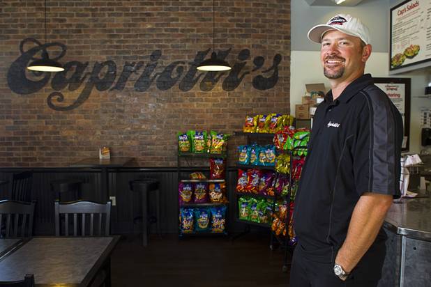 Thomas Gourley poses at his Capriotti's sandwich shop, 90 S. Stephanie St., in Henderson Wednesday, July 24, 2013. Gourley and his partner Corey Melendrez own six Capriotti's and will open a seventh in St. George, Utah in August, he said.