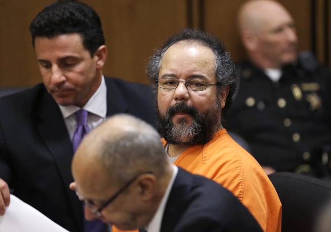 Ariel Castro looks over at the prosecutors table during court proceedings Friday, July 26, 2013, in Cleveland. Castro, who imprisoned three women in his home, subjecting them to a decade of rapes and beatings, pleaded guilty Friday to 937 counts in a deal to avoid the death penalty. In exchange, prosecutors recommended Castro be sentenced to life without parole plus 1,000 years.