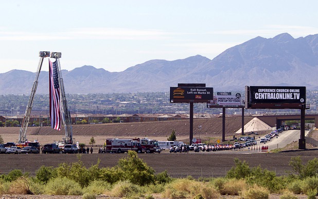 A funeral procession for Metro Police Officer David Vanbuskirk, 36, arrives at Central Christian Church in Henderson Monday, July 29, 2013. Vanbuskirk fell to his death July 22 while rescuing a stranded hiker on Mount Charleston. 